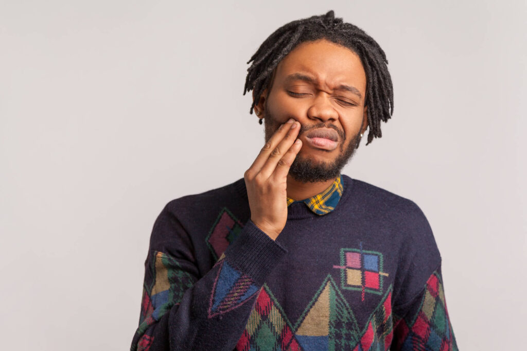 man suffers tooth pain needs Emergency Dentistry Summerfield FL